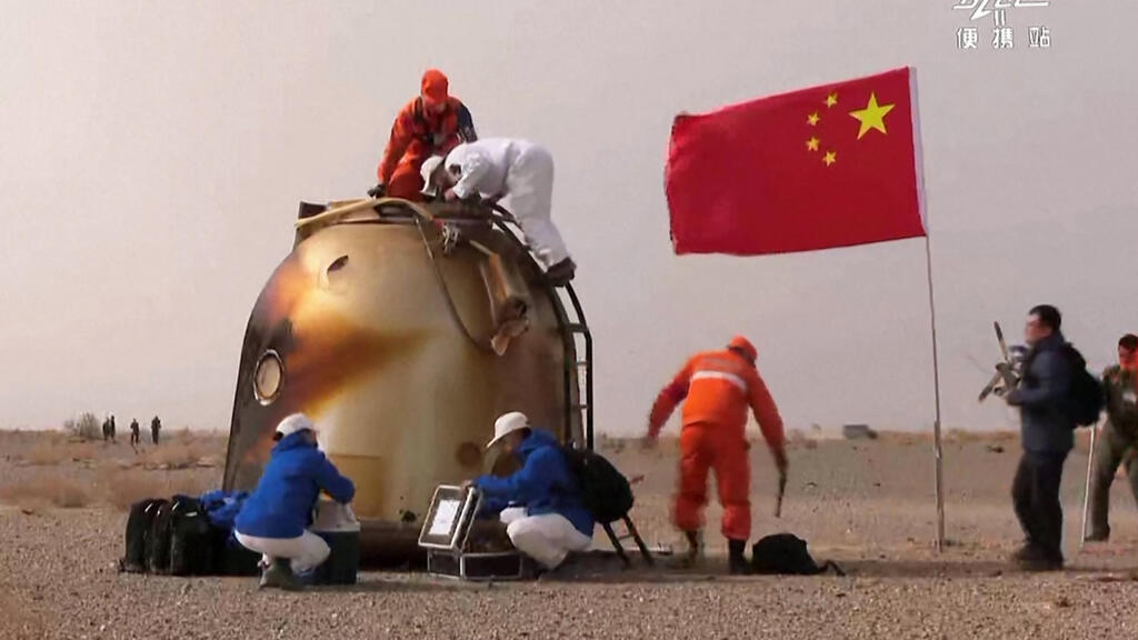 Chinese astronauts return to Earth after six months on space station
