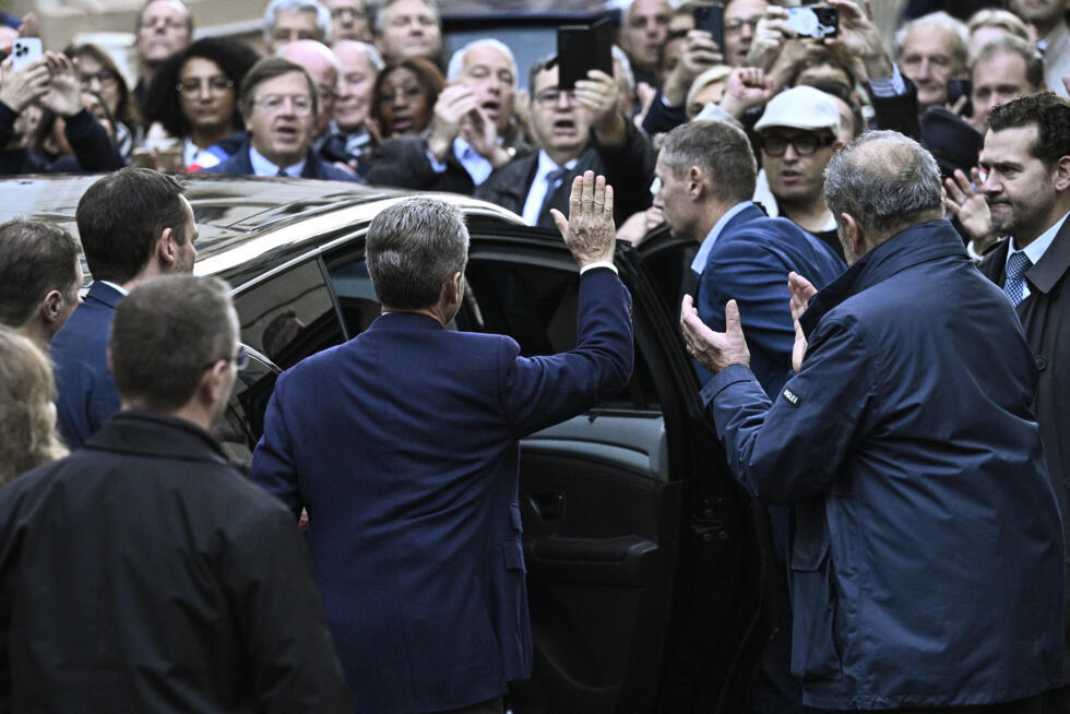 Sarkozy waved to supporters as he left his home on October 21, 2025.