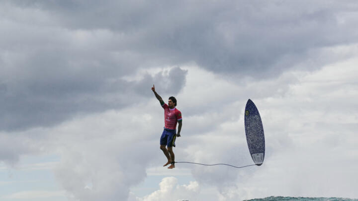 This picture of Brazil's Gabriel Medina exiting a wave in Tahiti on his way to Olympic gold has won high praise for AFP photographer Jerome Brouillet