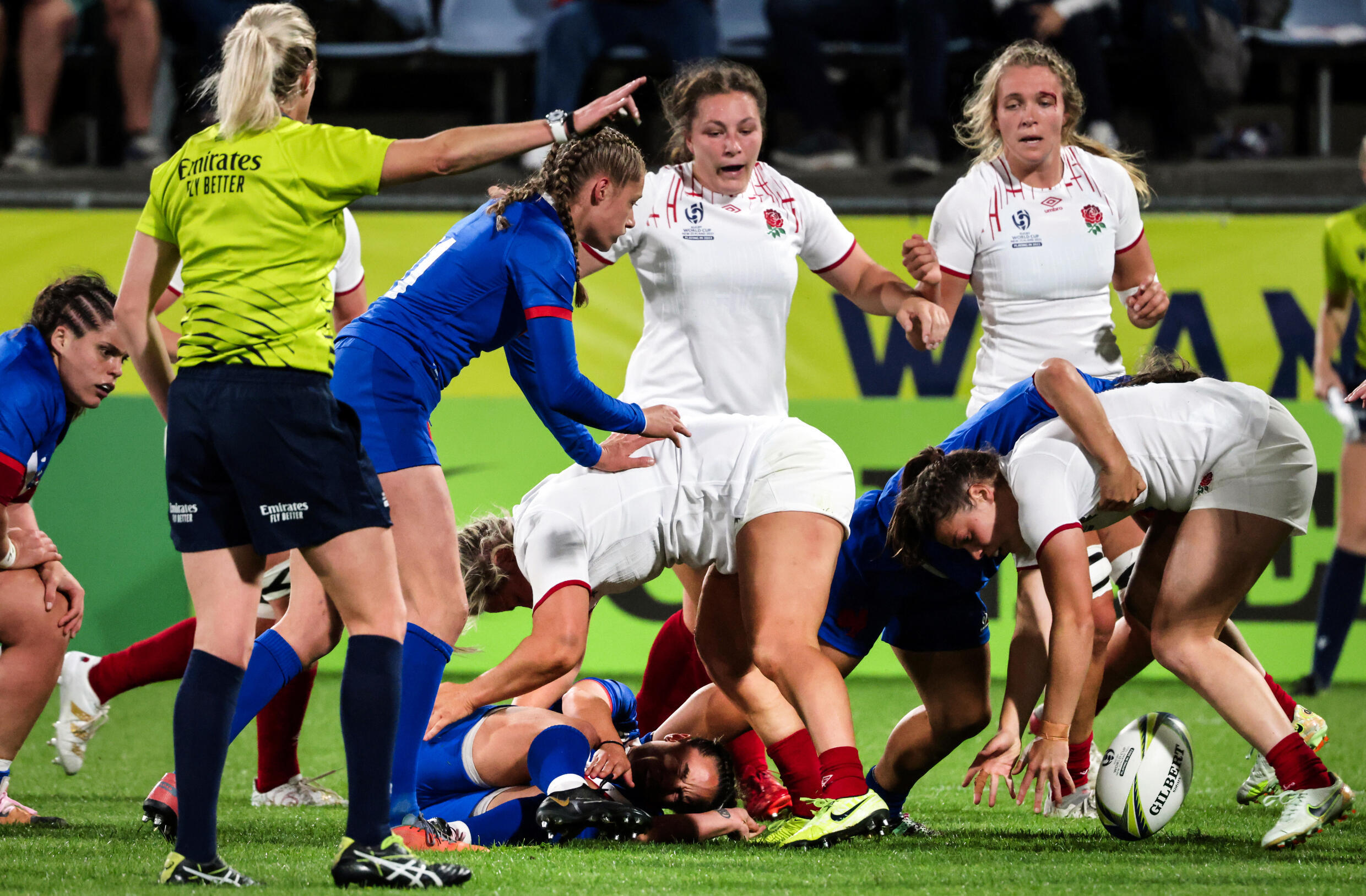 France's Laure Sansus (middle, bottom) is on the floor after being seriously injured during the Women's Rugby World Cup match in Group C between France and England, in Whangarei on October 15, 2022.