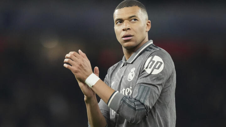 Real Madrid's Kylian Mbappé applauds fans at the end of the Champions League quarterfinal between Arsenal and Real Madrid at the Emirates Stadium in London, Tuesday, April 8, 2025.
