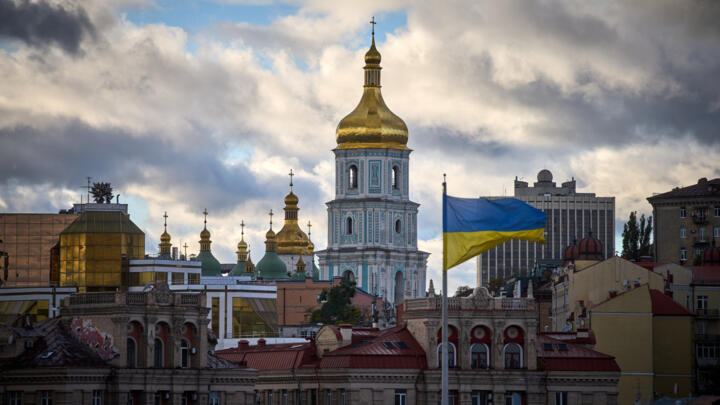 Ukrainian flag on Independence Square in central Kyiv with the St. Sophia Cathedral in the background
