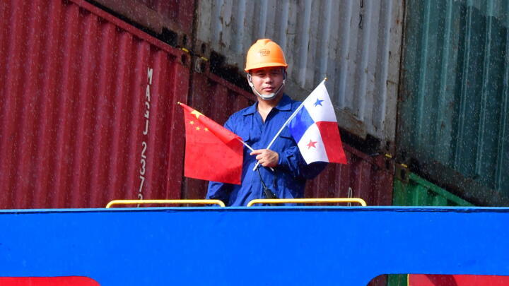 A crew member on board a Chinese container ship pictured during Xi Jinping's trip to Panama in December 2018.