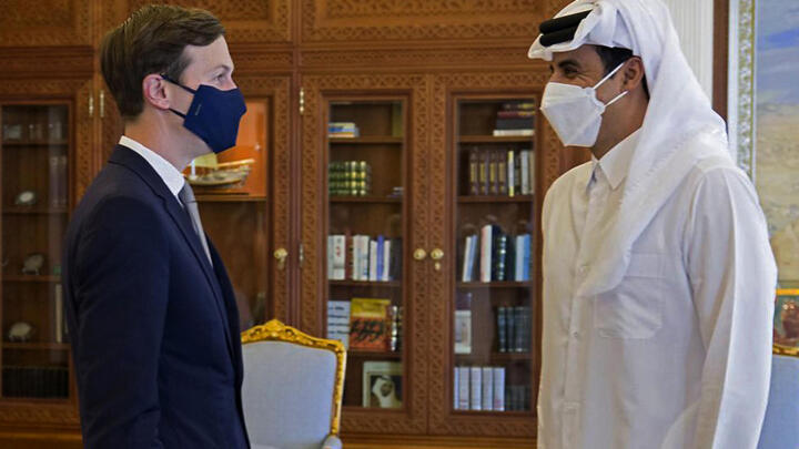 A handout photo released by the Qatar News Agency (QNA) on December 2, 2020, shows Senior Advisor to US President Jared Kushner (L) meeting with Qatar's ruler Emir Sheikh Tamim bin Hamad al-Thani in the capital Doha.