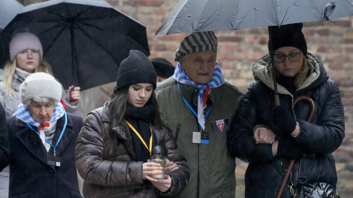 Holocaust survivors and relatives arrive at the Auschwitz Nazi death camp in Oswiecim, Poland, January 27, 2024.