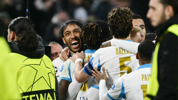 Marseille's Gabonese forward #97 Pierre-Emerick Aubameyang (C) celebrates with teammates after scoring his team's first goal during the UEFA Champions League, league phase - matchday 5, football match