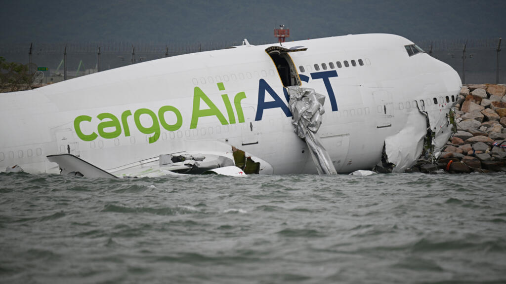 Cargo plane veers off Hong Kong runway and into sea, killing two