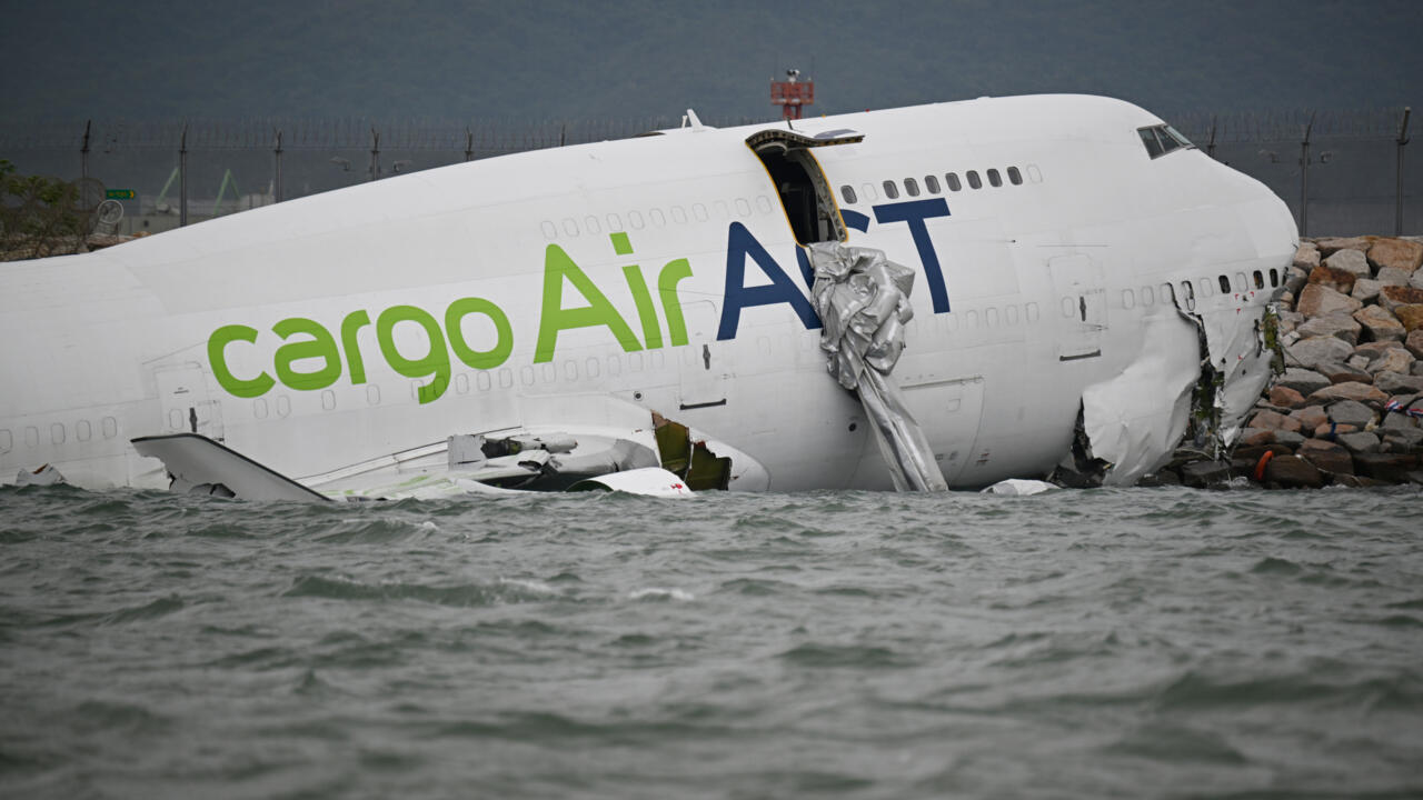 Cargo plane veers off Hong Kong runway and into sea, killing two