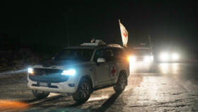 A Red Cross convoy carrying the body of a person believed to be a deceased hostage travels toward the border crossing with Israel, in Deir al-Balah, Gaza on November 7, 2025. 