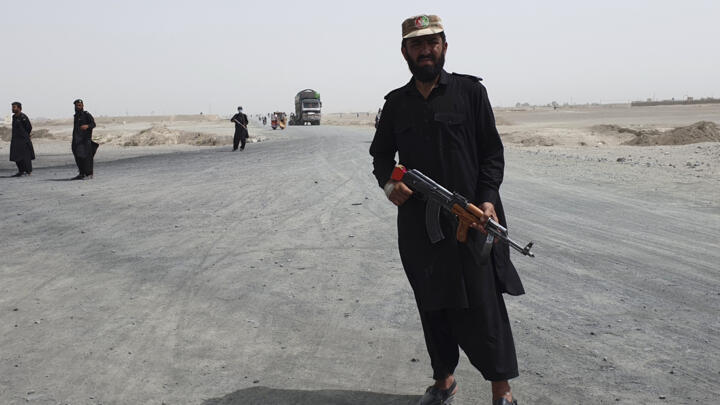 Pakistani paramilitary soldiers stand guard near the Pakistan Afghan border crossing in SpinBoldak border area, in Chaman, Pakistan, on July 16, 2021.