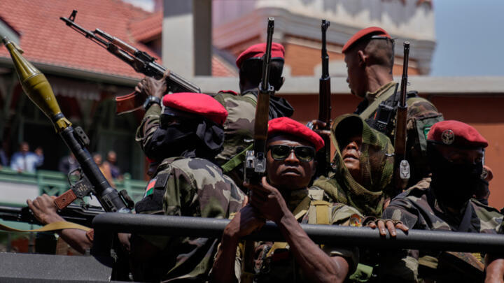 Soldiers loyal to Col. Michael Randrianirina guard the entrance of the high constitutional court in Antananarivo, Madagascar on October 17, 2025.
