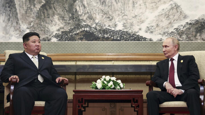 Russian President Vladimir Putin (right) speaks with North Korean leader Kim Jong-un during their meeting in Beijing, China, on September 3, 2025.