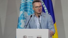 Chris Bowen, minister for climate change and energy of Australia, speaks during a plenary session at the COP30 UN Climate Summit, Monday, Nov. 17, 2025, in Belem, Brazil. 