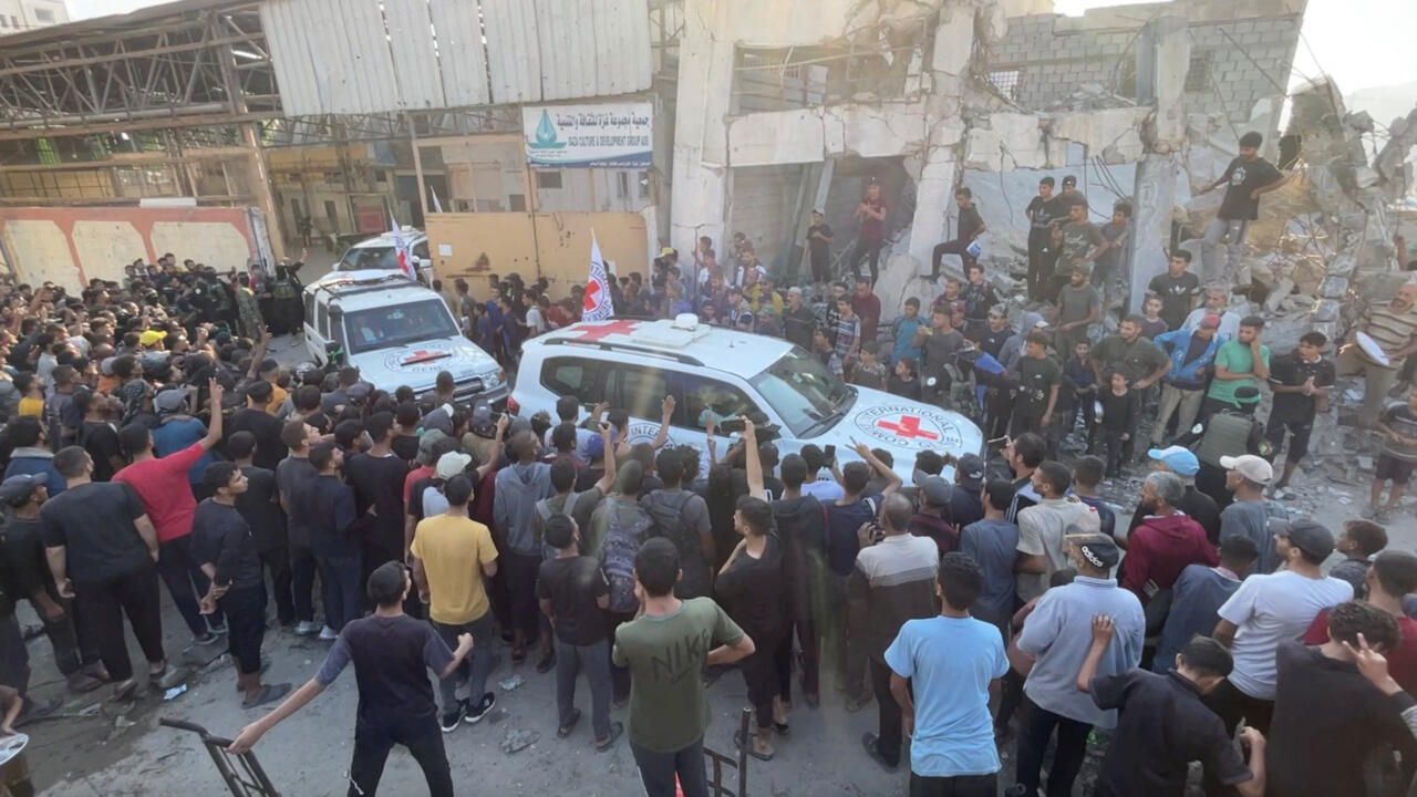 Red Cross vehicles transport Israeli hostages in Gaza City October 13, 2025.