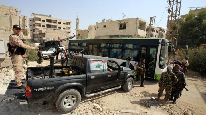 Kerry, Lavrov push for Syria deal as first evacuees leave besieged Damascus suburb