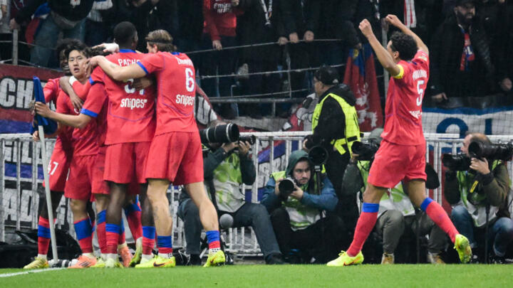 Paris Saint-Germain's Portuguese midfielder #87 Joao Neves (unseen) celebrates with teammates after scoring his team third goal during the French L1 football match. 