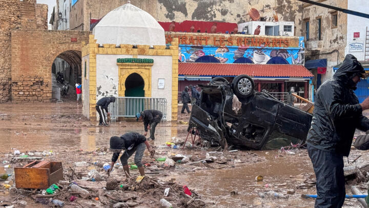 People inspect the damage caused by flash floods in Safi, Morocco.