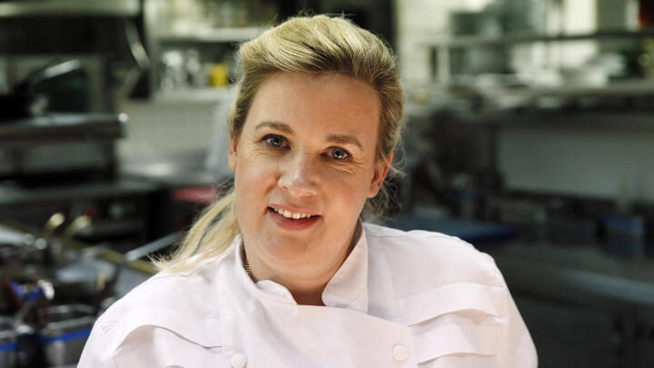French chef Hélène Darroze poses in her Paris restaurant in 2015 after winning a "World's Best Female Chef" award. She has since become the first woman to pick up two Michelin stars at once.