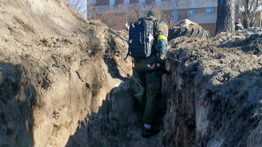 From trenches to camouflage nets, Ukraine civilians join defence efforts