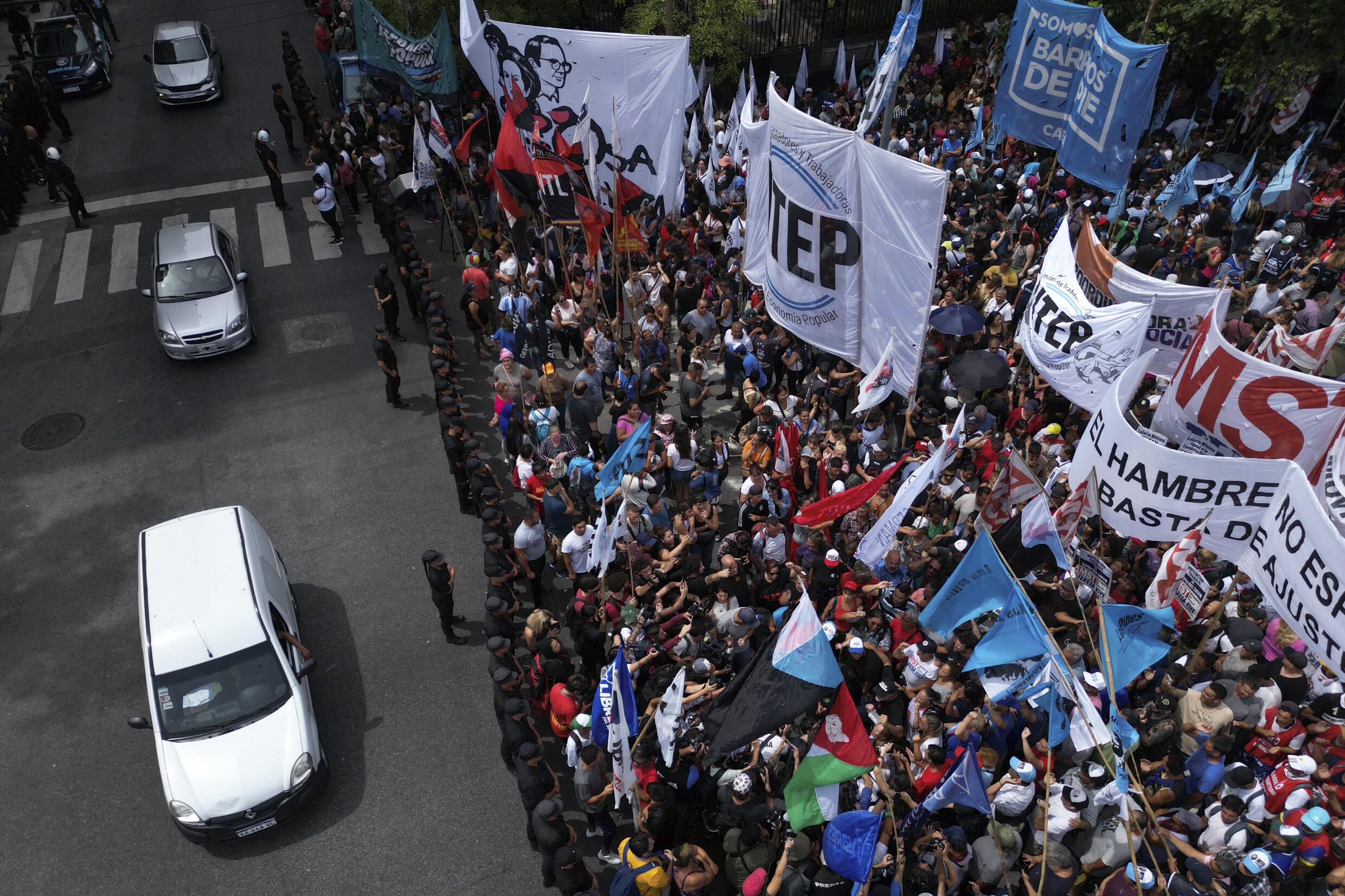 In this aerial view, members of social organizations gather in front of the Ministry of Human Capital to protest against the shortage of food in soup kitchens and the 'shock' plan of the government of President Javier Milei in Buenos Aires, on February 23, 2024.