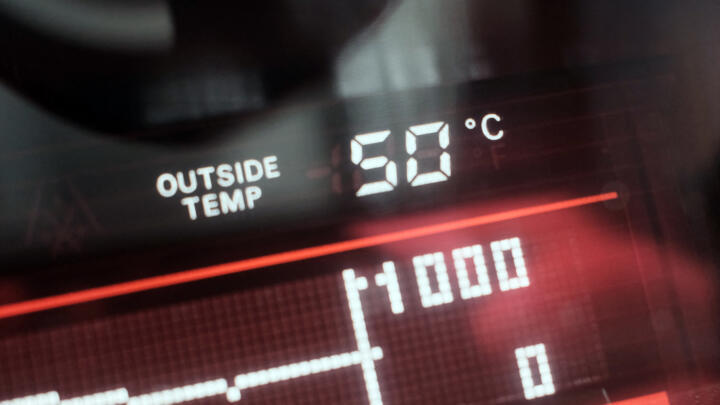 A dashboard display shows an external temperatue of 50 degrees Celsius in a vehicle in Dubai on May 23, 2025.