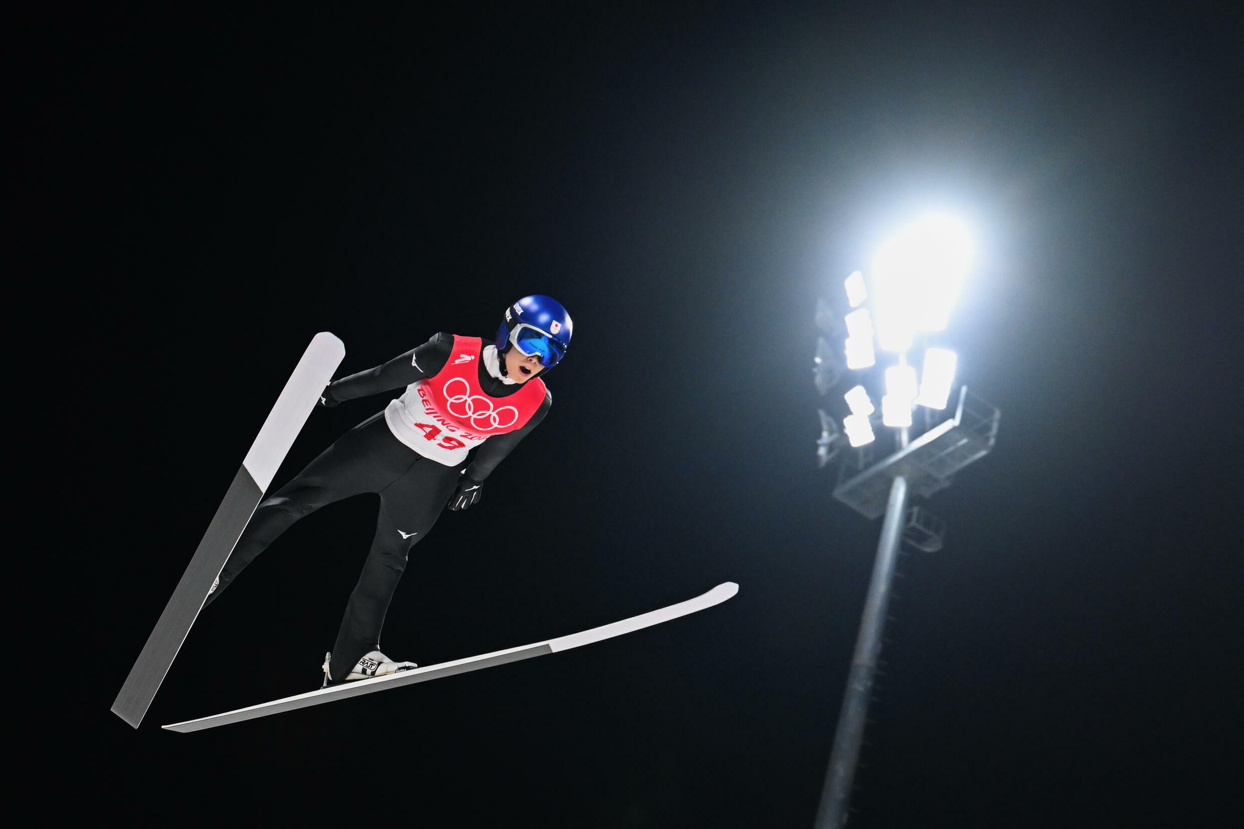 During the Beijing 2022 Winter Olympics, on February 6, 2022, at the Zhangjiago National Ski Jumping Center, Rio Kopayashi of Japan competes in the men's Ski Jump Individual Round 1 on the normal slope.