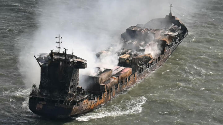 Smoke rises from the container ship Solong in the North Sea, off Withernsea, eastern England, on March 11, 2025, the day after her collision with the tanker Stena Immaculate.