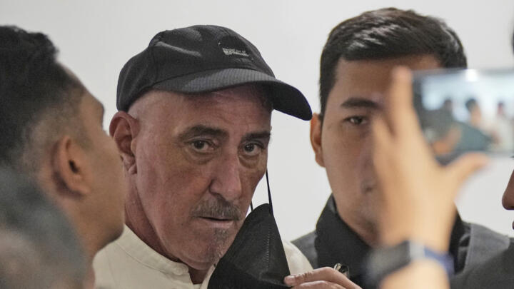Serge Atlaoui (centre) attends a press conference at Soekarno-Hatta International Airport in Tangerang, Indonesia, ahead of his return to France, on February 4, 2025.