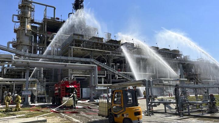 Russian firefighters try to put out a blaze caused by a drone strike at the Novoshakhtinsk oil processing plant in the Rostov-on-Don region in Russia, on June 22, 2022.
