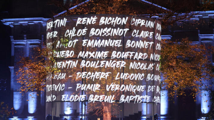 Names of victims are projected during a sound and light show as part of a ceremony marking a decade since the terror attacks of November 13, 2015 in which 130 civilians were killed, at the "Jardin du 13 novembre 2015" in Paris on November 13, 2025.