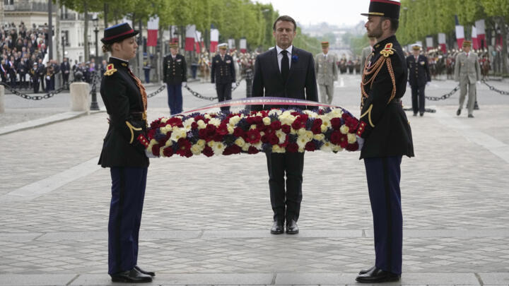 French President Emmanuel Macron lays a wreath of flowers at the Unkown Soldier tomb under the Arc de de Triomphe during ceremonies marking Victory Day, Monday, May 8, 2023 in Paris.