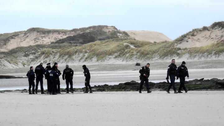 Police patrol Wimereux beach in northern France on December 20, 2021.