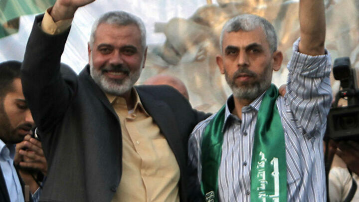 File photo: Hamas political leader Ismail Haniyeh (L) and Gaza leader Yahya Sinwar shown in the Palestinian coastal territory in October 2011. 
