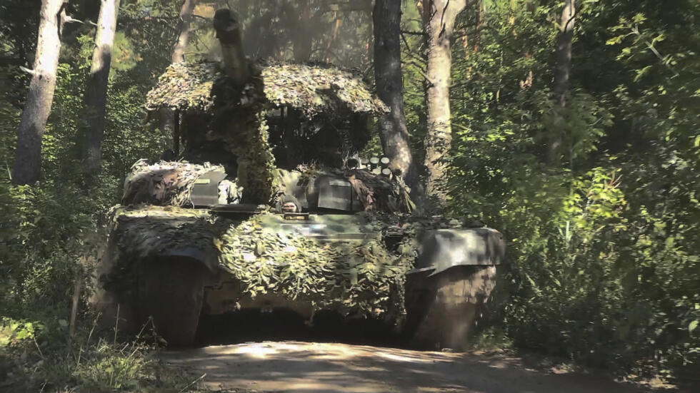 In this photo taken from a video released by the Russian defence ministry on August 17, 2024, a Russian T-72B3M tank drives at an undisclosed location in Russia’s Kursk region.