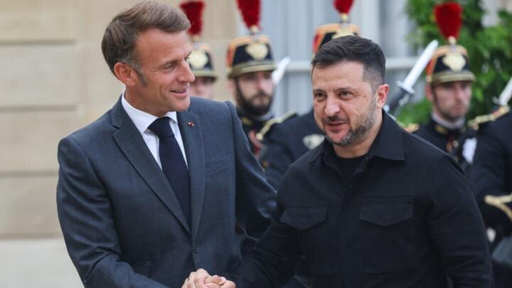 France's President Emmanuel Macron shakes hands with Ukraine's President Volodymyr Zelensky, ahead of a meeting at The Elysee Presidential Palace in Paris on September 3, 2025.
