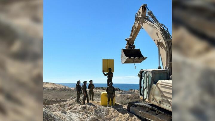 This photo was posted on X on October 20 by the Israeli Army. It shows construction equipment delineating the so-called "yellow line”.
