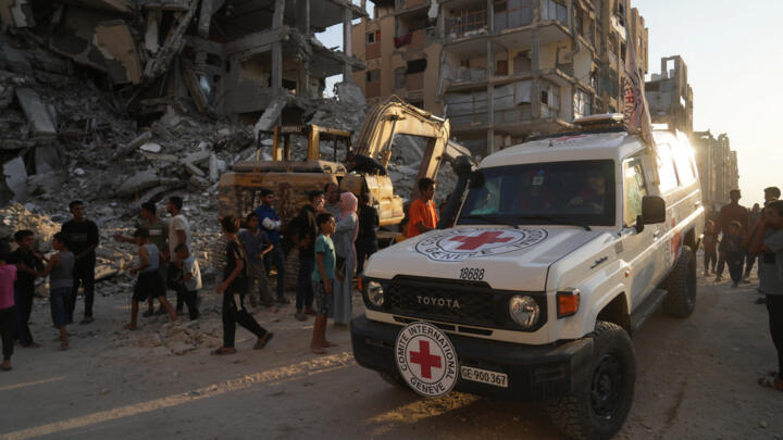 A Red Cross vehicle arrives at the site where members of the Hamas militant group work on searching for bodies of the hostages in an area in Khan Younis, Gaza, Friday, October 17, 2025.