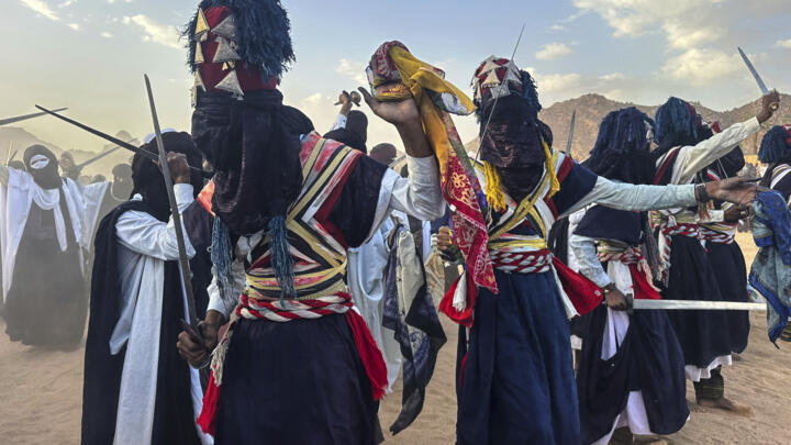 Zelouaz, Algeria dancers perform on the last day of the Sebeiba festival in Djanet, a southeastern Algerian oasis town in the Sahara desert, on July 6, 2025.