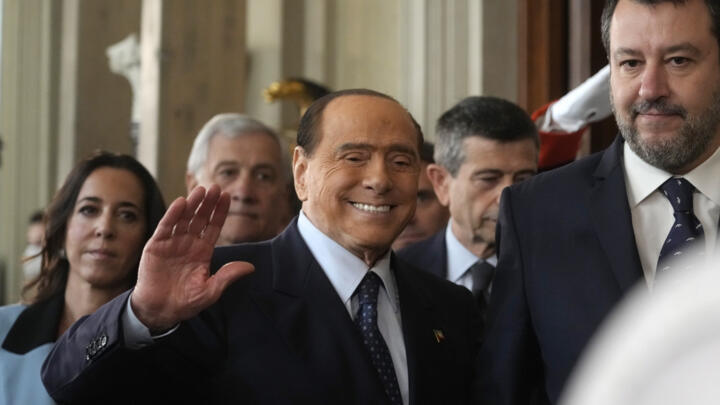 Forza Italia's president Silvio Berlusconi waves, center, flanked by The League leader Matteo Salvini, right, and Senator Licia Ronzulli, left, as they arrive at the Quirinale Presidential Palace, in Rome, on Oct. 21, 2022.