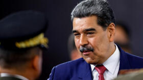 FILE PHOTO: Venezuela's President Nicolas Maduro prepares to leave at the end of a press conference.