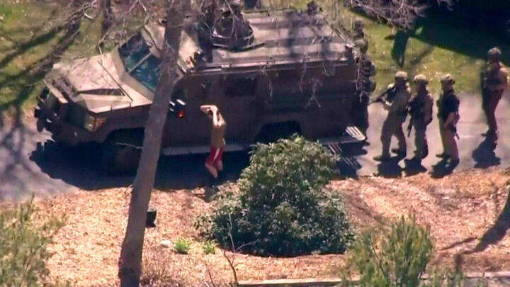 Aerial footage from a local news helicopter shows suspect national guardsman Jack Teixeira taken into custody by FBI agents in North Dighton, Massachusetts on April 13, 2023.