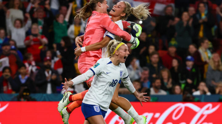 England players celebrate after defeating Nigeria on penalties in Brisbane to reach the Women's World Cup quarter-finals.