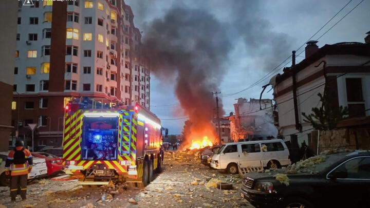 Ukrainian law enforcement officers work at the site of an air attack at an undisclosed location in the Kyiv region on September 28, 2025.