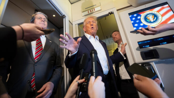US President Donald Trump speaks to reporters aboard Air Force One while traveling from Kuala Lumpur, Malaysia, to Tokyo, Japan, Monday, Oct. 27, 2025.