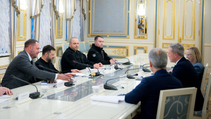 Ukrainian President Volodymyr Zelensky, second left, talks with US Secretary of the Army Dan Driscoll in Kyiv, Ukraine, November 20, 2025.