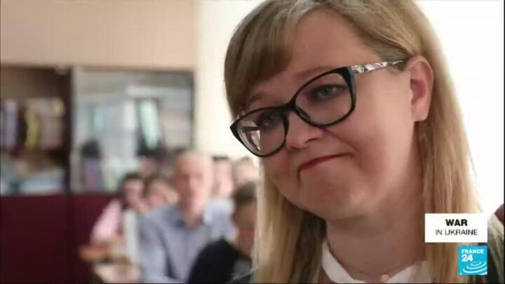 War in Ukraine: City of Mariupol learns to live at 'Russian time'