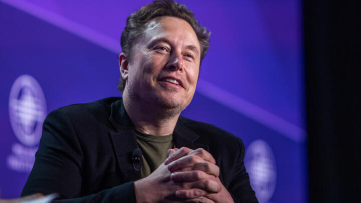 Elon Musk has threatened to ban iPhones inside his companies, saying an alliance between Apple and OpenAI has him worried about data security.