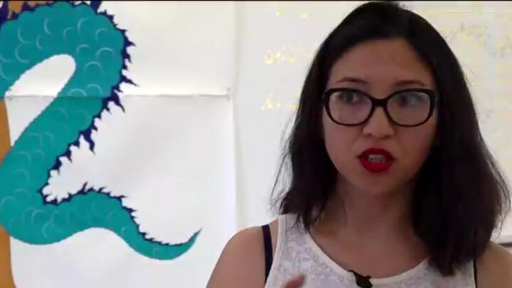 Artist Kubra Khademi speaks to France 24 in front of one of her artworks on display in Paris, France.
