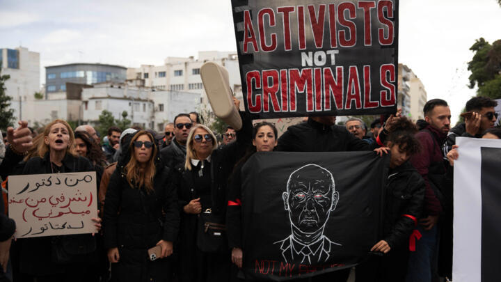 Protesters demand the release of political prisoners in Tunis, Tunisia on November 22, 2025.