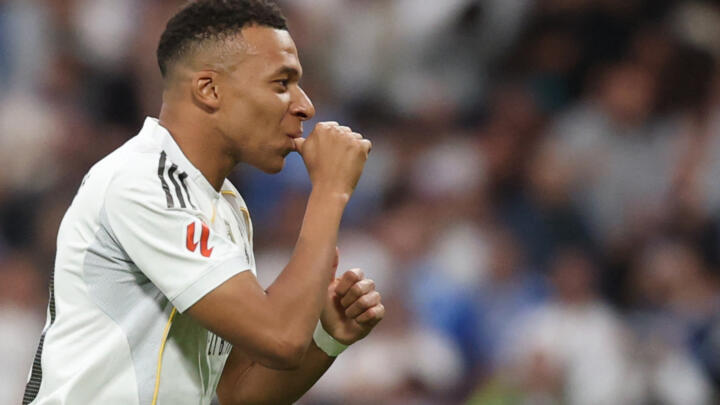 Real Madrid's French striker No. 10, Kylian Mbappé, celebrates the first goal, which was ultimately disallowed, during the Spanish league football match between Real Madrid CF and FC Barcelona at the 